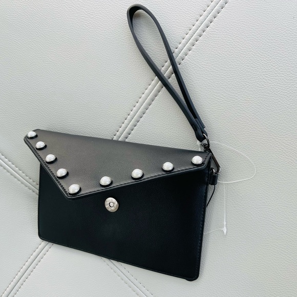 New With Tags
BCBG Pearl + Leather Inspired
Envelope Clutch in
BLACK - Picture 14 of 15